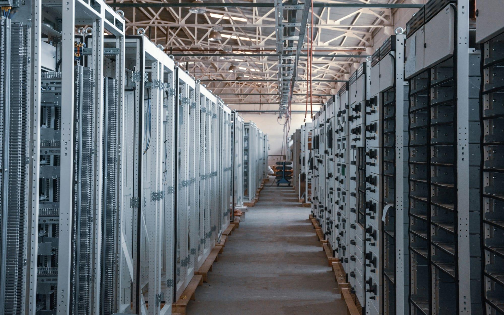 Aisle between rows of server racks in a data hall