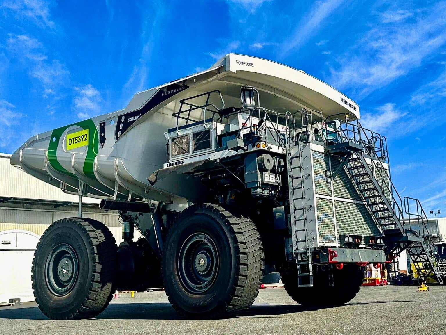 Fortescue mine haul truck parked in a workshop yard